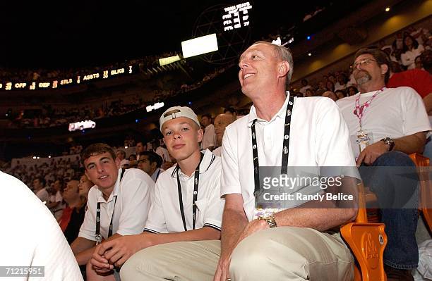High school basketball player Jason McElwain attends Game Four of the 2006 NBA Finals between the Miami Heat and the Dallas Mavericks with his father...