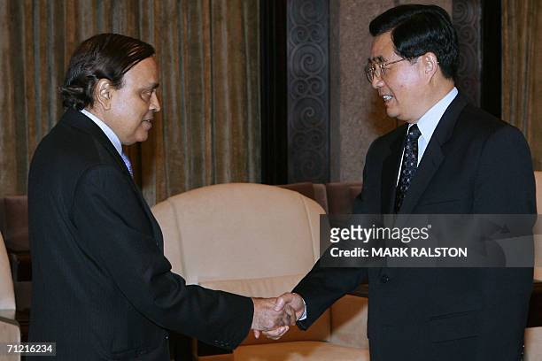 Indian Minister of Petroleum and Natural Gas, Murali Deora meets with Chinese President Hu Jintao during their bilateral meeting at the Xijiao State...