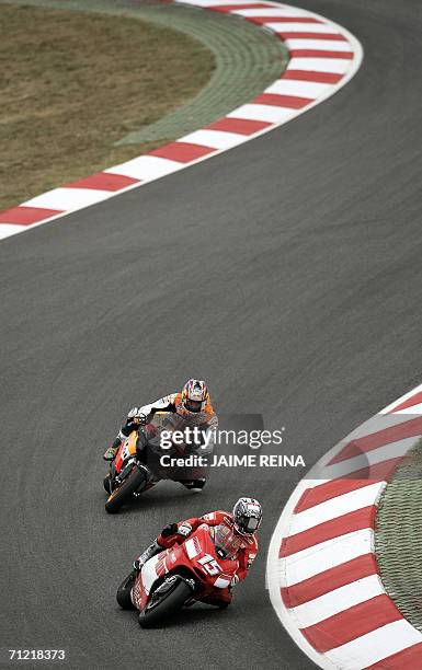 Spanish rider Sete Gibernau leads in front of USA's Nick Hayden 16 June 2006 during the first free practice session ahead of the 18 June 2006...