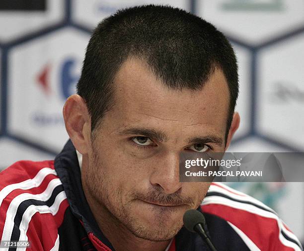French defender Willy Sagnol gestures during a press conference at the Rattenfanger Halle in Hameln 16 June 2006 during the Fifa World Cup 2006....