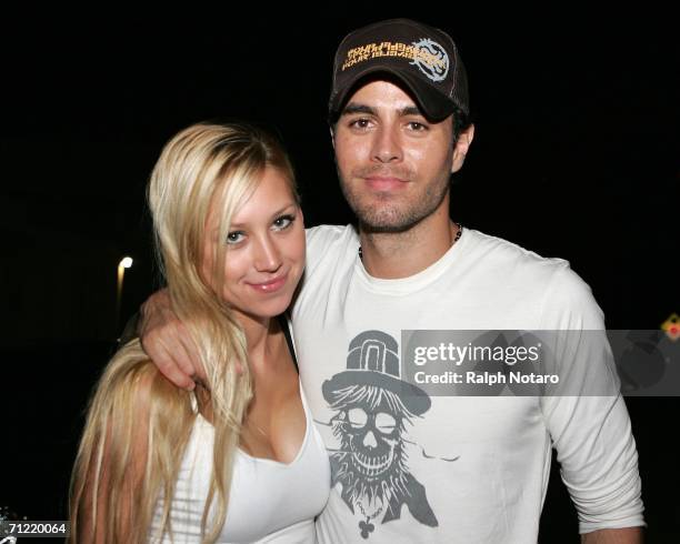 Tennis player Anna Kournikova and singer Enrique Iglesias leave Big Pink restaurant during the early morning hours on June 16, 2006 in Miami, Florida.