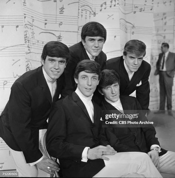 American singing group The Dave Clark Five pose on stage at 'The Dave Clark Five,' New York, New York, March 3, 1964. Clockwise from top: Dave Clark,...