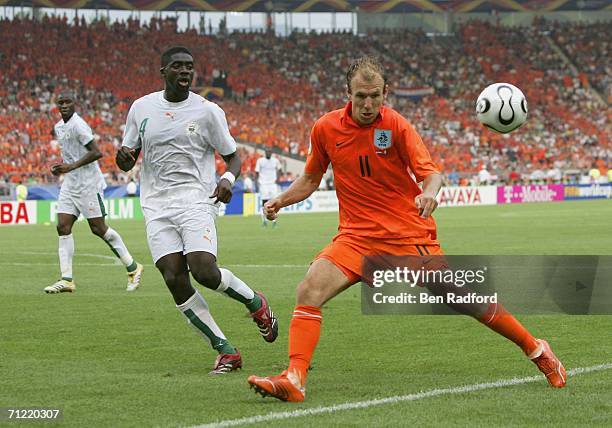 Arjen Robben of the Netherlands controls the ball, as Kolo Toure of the Ivory Coast closes in during the FIFA World Cup Germany 2006 Group C match...