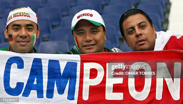 Mexican supporters pose prior to the start of the 2006 World Cup Group D football match Mexico vs. Angola, 16 June 2006, in Hanover, Germany. AFP...