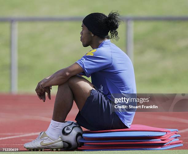 Ronaldinho of Brazil takes a rest on some mats during the training session and press conference of the Brazilian National Team for the FIFA World Cup...