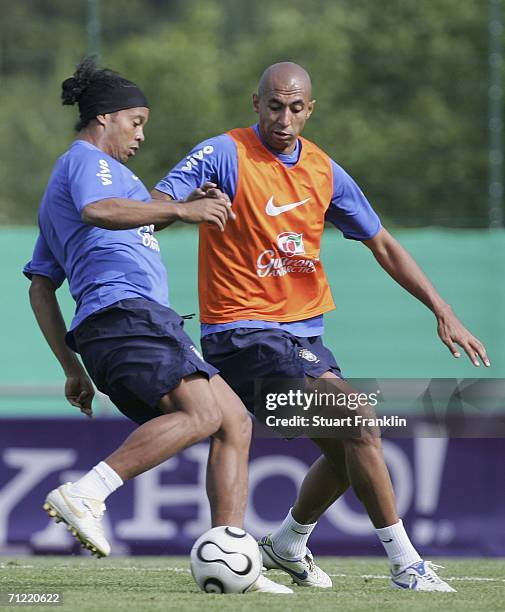 Ronaldinho of Brazil challenges Luisao of Brazil during the training session of the Brazilian National Team for the FIFA World Cup 2006 on June 16,...