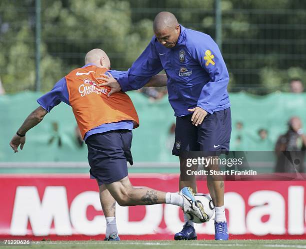 Cris of Brazil challenges Ronaldo of Brazil during the training session of the Brazilian National Team for the FIFA World Cup 2006 on June 16, 2006...