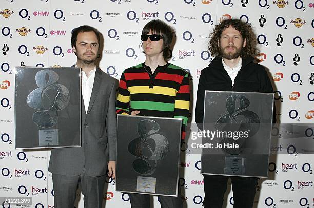 Nick Baines, Nick Hodgson, Simon Rix of the Kaiser Chiefs, winners of the Best British Group sponsored by Live Nation, pose in the awards room the O2...