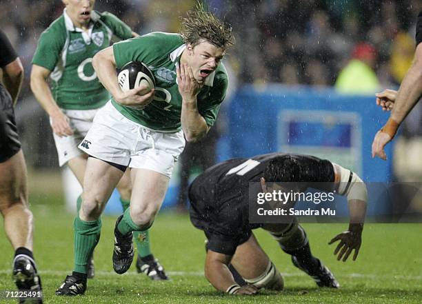 Brian O'Driscoll of Ireland reaches for his neck after Troy Flavell of New Zealand made a head high tackle during the international rugby test match...