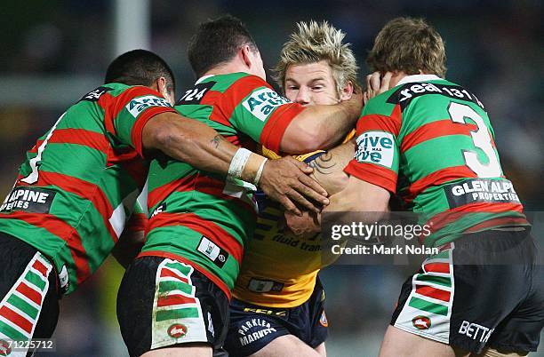 Glenn Morrison of the Eels crashes into the Rabbitohs defence during the round 15 NRL match between the Parramatta Eels and the South Sydney...