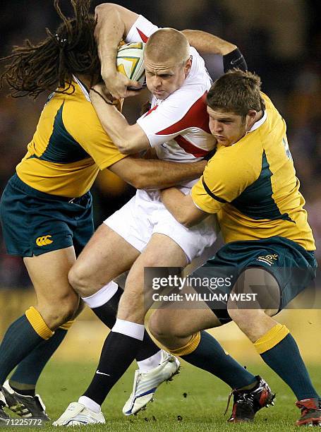 England fullback Iain Balshaw is tackled by Australia defenders George Smith and Greg Holmes during the second Test Match being played at Melbourne's...