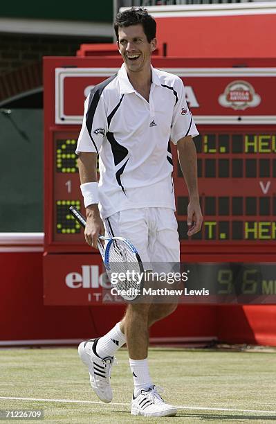 Tim Henman of Great Britain smiles against Lleyton Hewitt of Australia during Day 6 of the Stella Artois Championships at Queen's Club on June 17,...