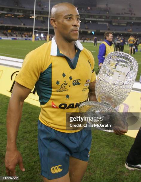 George Gregan of the Wallabies walks with the Cook Cup after defeating England during the second Cook Cup match between the Australian Wallabies and...