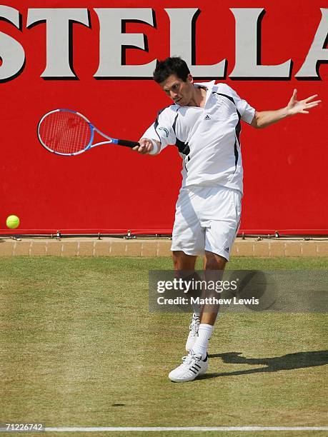 Tim Henman of Great Britain in action against Lleyton Hewitt of Australia during Day 6 of the Stella Artois Championships at Queen's Club on June 17,...
