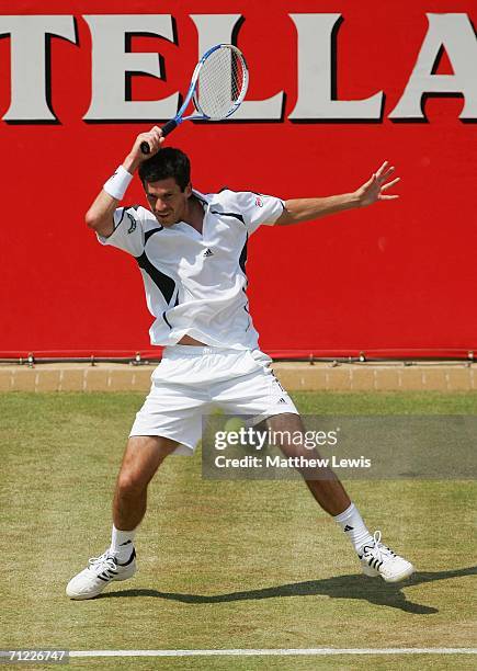 Tim Henman of Great Britain in action against Lleyton Hewitt of Australia during Day 6 of the Stella Artois Championships at Queen's Club on June 17,...