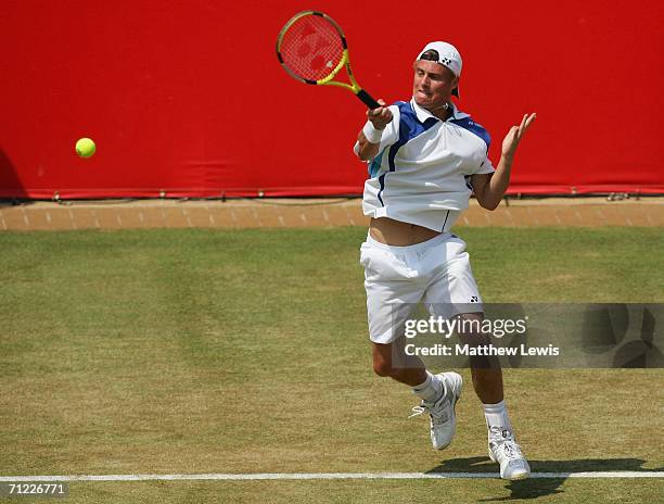 Lleyton Hewitt of Australia in action against Tim Henman of Great Britain during Day 6 of the Stella Artois Championships at Queen's Club on June 17,...