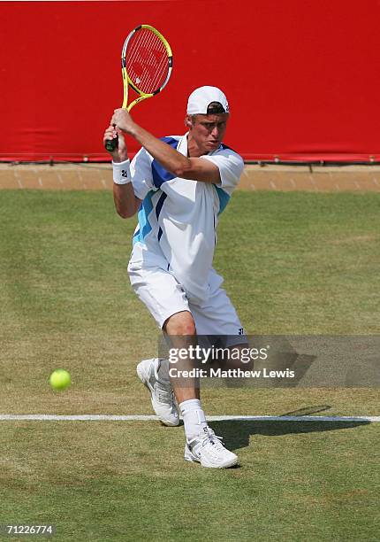 Lleyton Hewitt of Australia in action against Tim Henman of Great Britain during Day 6 of the Stella Artois Championships at Queen's Club on June 17,...