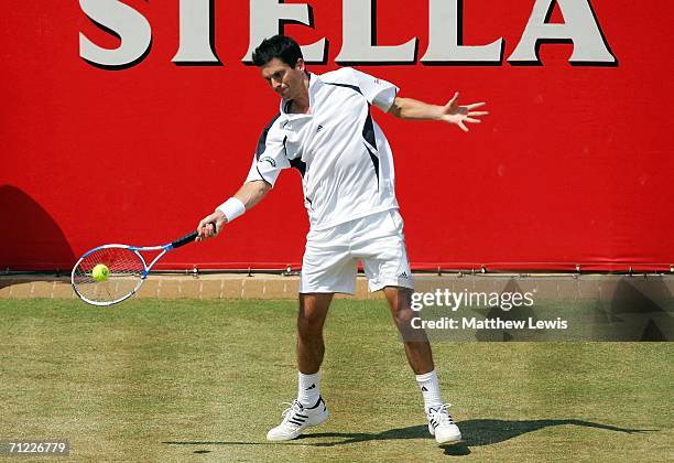 Tim Henman of Great Britain in action against Lleyton Hewitt of Australia during Day 6 of the Stella Artois Championships at Queen's Club on June 17,...