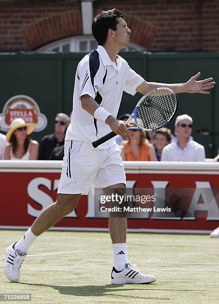 Tim Henman of Great Britain questions a line call against Lleyton Hewitt of Australia during Day 6 of the Stella Artois Championships at Queen's Club...