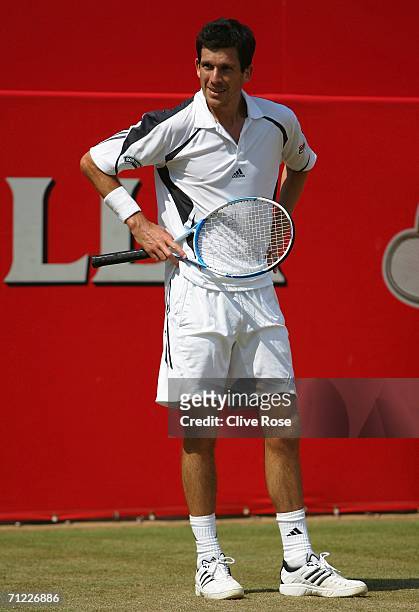 Tim Henman of Great Britain looks dejected against Lleyton Hewitt of Australia during Day 6 of the Stella Artois Championships at Queen's Club on...