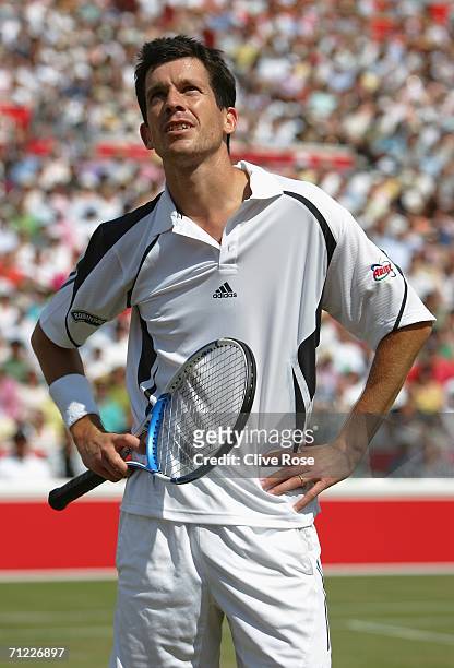 Tim Henman of Great Britain talks to the umpire against Lleyton Hewitt of Australia during Day 6 of the Stella Artois Championships at Queen's Club...