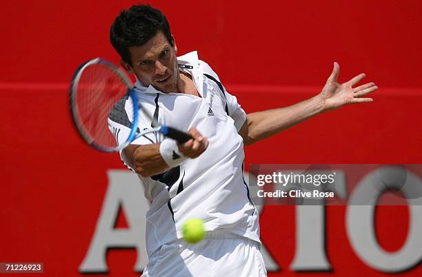 Tim Henman of Great Britain in action against Lleyton Hewitt of Australia during Day 6 of the Stella Artois Championships at Queen's Club on June 17,...