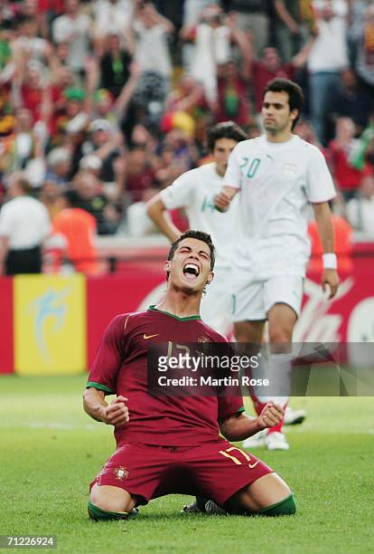 Cristiano Ronaldo of Portugal falls to his knees in celebration after scoring his team's second goal from the penalty spot during the FIFA World Cup...