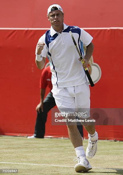 Lleyton Hewitt of Australia celebrates victory against Tim Henman of Great Britain during Day 6 of the Stella Artois Championships at Queen's Club on...