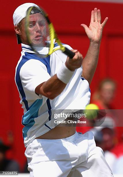 Lleyton Hewitt of Australia in action against Tim Henman of Great Britain during Day 6 of the Stella Artois Championships at Queen's Club on June 17,...