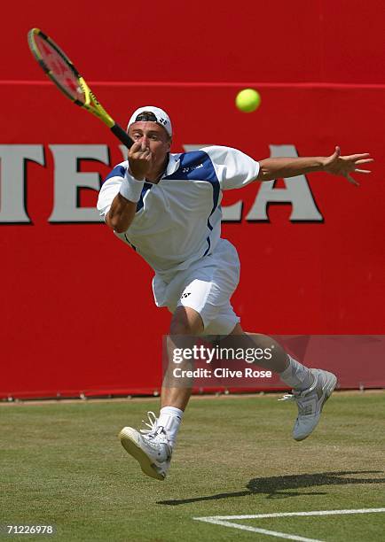 Lleyton Hewitt of Australia in action against Tim Henman of Great Britain during Day 6 of the Stella Artois Championships at Queen's Club on June 17,...