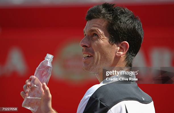 Tim Henman of Great Britain talks to the umpire against Lleyton Hewitt of Australia during Day 6 of the Stella Artois Championships at Queen's Club...