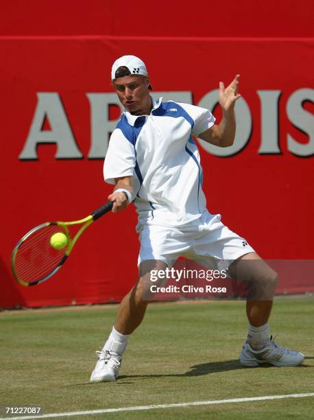 Lleyton Hewitt of Australia in action against Tim Henman of Great Britain during Day 6 of the Stella Artois Championships at Queen's Club on June 17,...