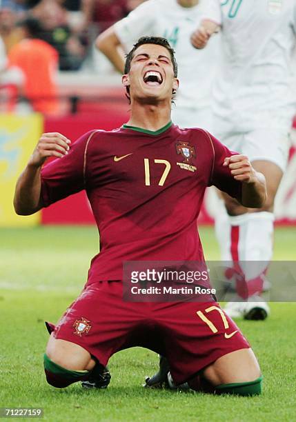 Cristiano Ronaldo of Portugal falls to his knees in celebration after scoring his team's second goal from the penalty spot during the FIFA World Cup...