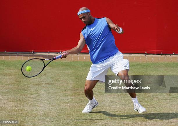 James Blake of the United States in action against Andy Roddick of the United States during Day 6 of the Stella Artois Championships at Queen's Club...