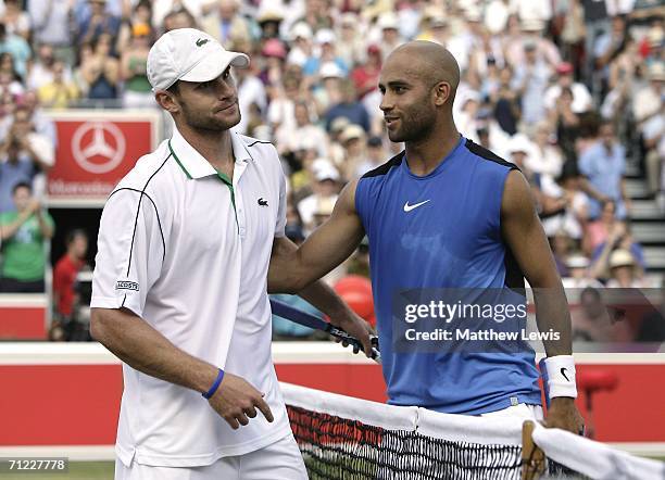 James Blake of the United States consoles Andy Roddick of the United States during Day 6 of the Stella Artois Championships at Queen's Club on June...
