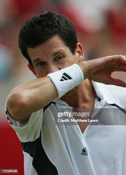 Tim Henman of Great Britain looks dejected against Lleyton Hewitt of Australia during Day 6 of the Stella Artois Championships at Queen's Club on...