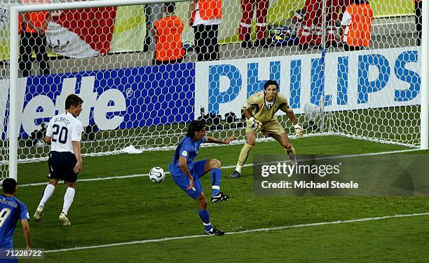 The ball deflects off Cristian Zaccardo of Italy and into the net for an own goal during the FIFA World Cup Germany 2006 Group E match between Italy...