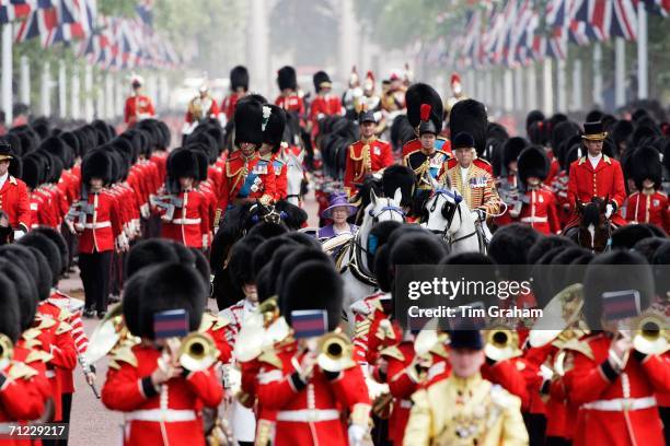 Queen Elizabeth II flanked by Princess Anne, Princess Royal and Prince Charles, Prince of Wales in the carriage procession along the Mall at Trooping...