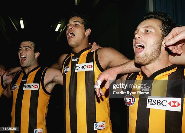 Jordan Lewis, Lance Franklin and Brad Sewell of the Hawks sings the club song after the round 12 AFL match between the Hawthorn Hawks and the...