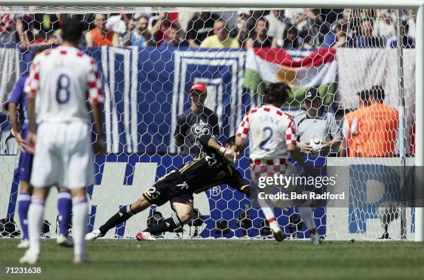 Goalkeeper Yoshikatsu Kawaguchi of Japan, dives to save the penalty kick from Darijo Srna of Croatia during the FIFA World Cup Germany 2006 Group F...