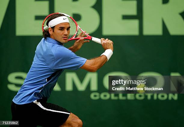 Roger Federer of Switzerland returns a shot to Tomas Berdych of the Czech Republic during the Gerry Weber Open June 18, 2006 at Gerry Weber Stadium...