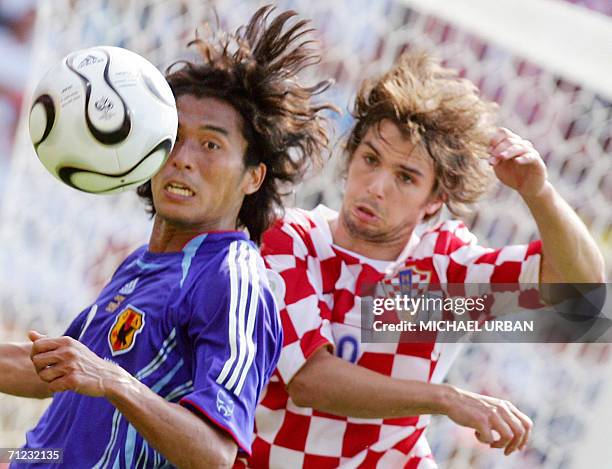 Croatian midfielder Niko Kranjcar vies with Japanese defender Yuji Nakazawa during the World Cup 2006 group F football match Japan vs Croatia, 18...