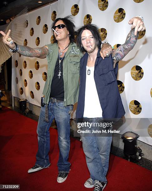 Nikki Sixx and a friend greet some of the photographers when they arrived at the 4th Annual Friends Of El Faro Fundraiser being held at the Music Box...