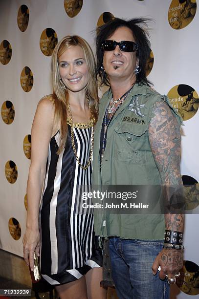 Molly Sims and Nikki Sixx arrive at the 4th Annual Friends Of El Faro Fundraiser being held at the Music Box at the Henry Fonda Theatre on June 17,...