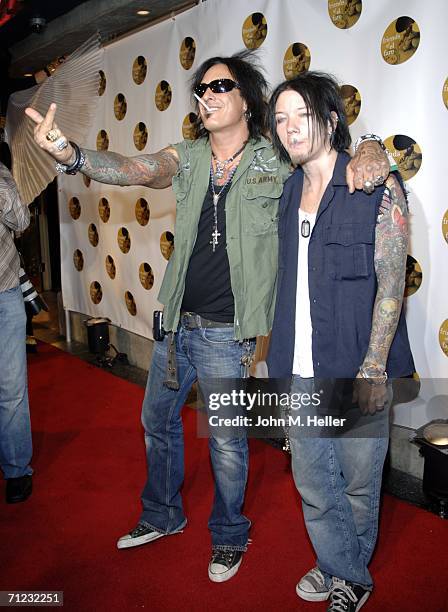 Nikki Sixx and a friend greet some of the photographers when they arrived at the 4th Annual Friends Of El Faro Fundraiser being held at the Music Box...