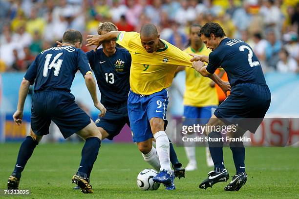 Ronaldo of Brazil is surrounded by Vince Grella Lucas Neill and Scott Chipperfield of Australia during the FIFA World Cup Germany 2006 Group F match...