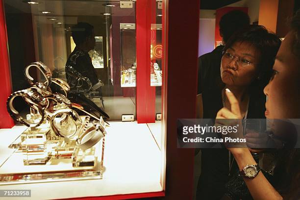 People view Omega watches during a Omega gala for the brand's new product release on June 17, 2006 in Shanghai, China. According to state media,...