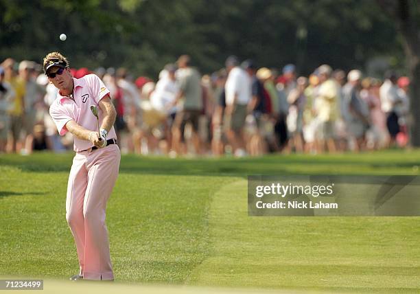 Ian Poulter of England hits a pitch shot to the eighth green hole during the final round of the 2006 US Open Championship at Winged Foot Golf Club on...