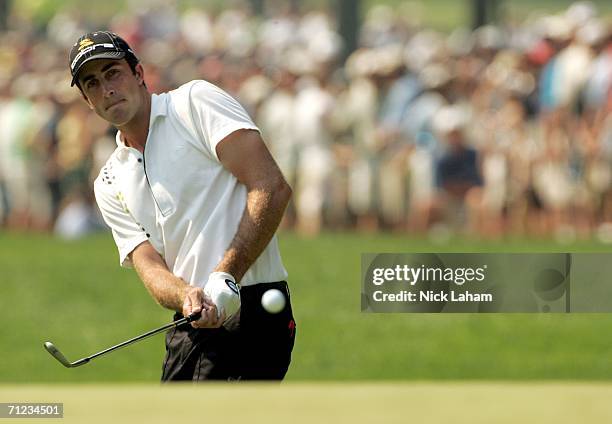 Geoff Ogilvy of Australia hits a pitch shot to the eighth green hole during the final round of the 2006 US Open Championship at Winged Foot Golf Club...