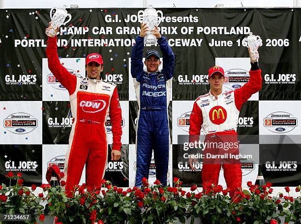 Allmendinger, driver of the Indeck Forsythe Championship Racing Lola Ford, celebrates with second place winner Justin Wilson and third place winner...